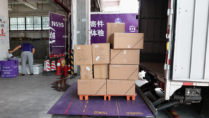 Hydraulic tail lift installed on delivery truck with cargo pallet ready for daily loading